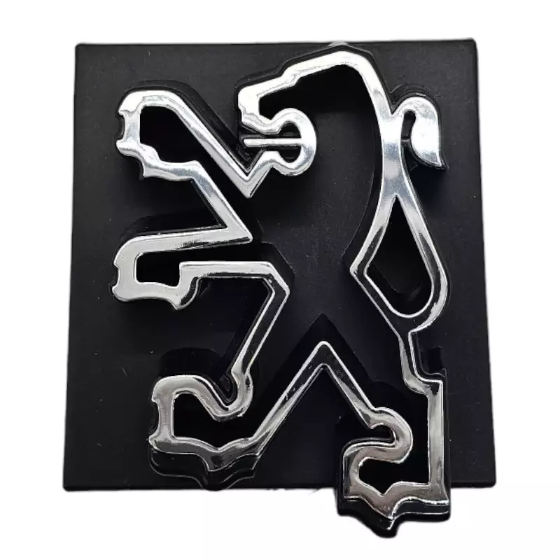 Black Peugeot 205 grille logo with chrome lion