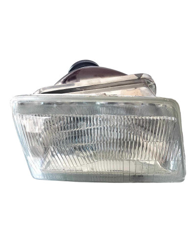 An H4 headlight on the right side of the Peugeot 205 GTI