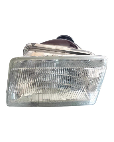 An H4 headlight on the left side of the Peugeot 205 GTI